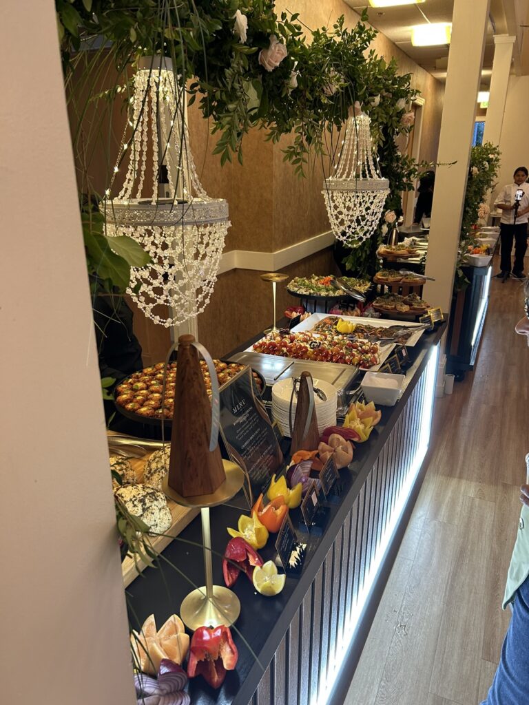 The dessert table under the chandeliers