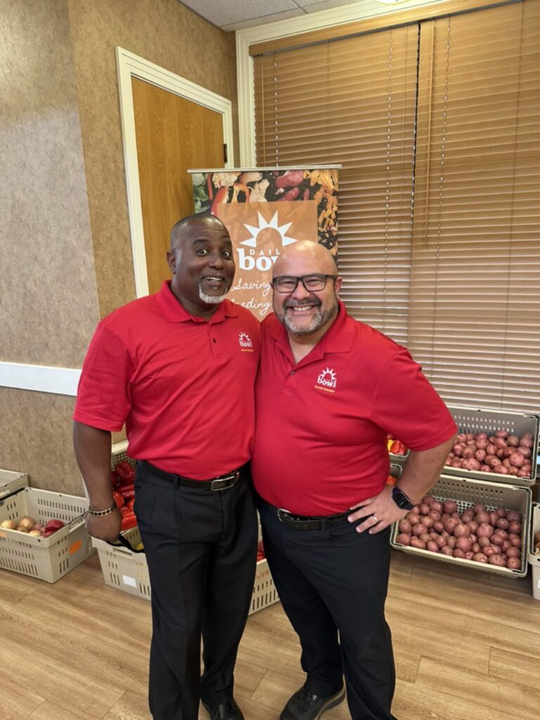 Two of the Daily Bowl team in their red shirts
